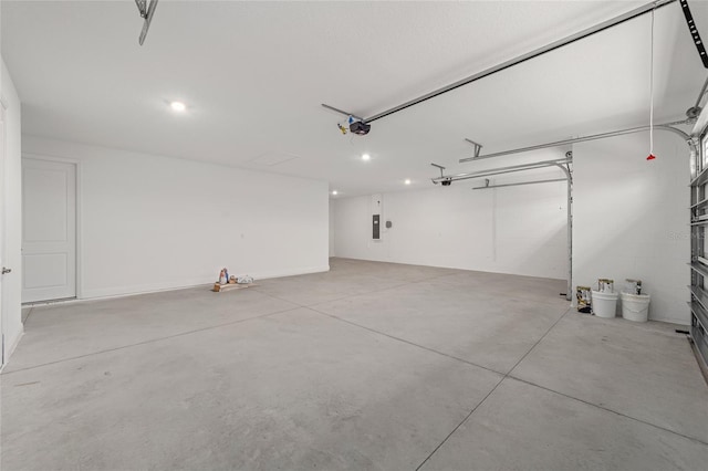 garage featuring a garage door opener and electric panel