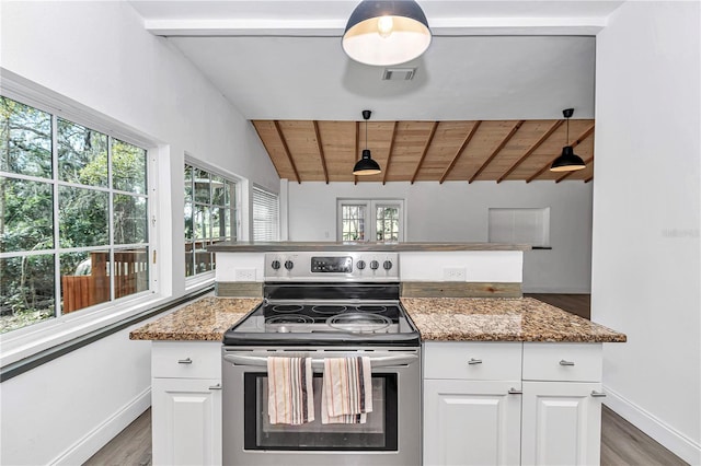 kitchen featuring stone countertops, white cabinets, and stainless steel electric range oven