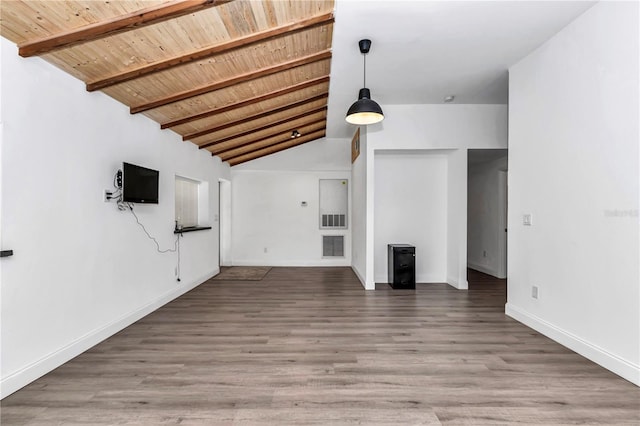 unfurnished living room featuring vaulted ceiling with beams, wooden ceiling, wood finished floors, and baseboards