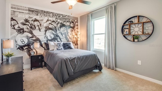 bedroom featuring baseboards, a ceiling fan, and light colored carpet