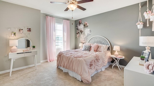 bedroom with light carpet, ceiling fan, and baseboards