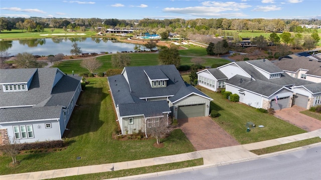 bird's eye view with a residential view and a water view