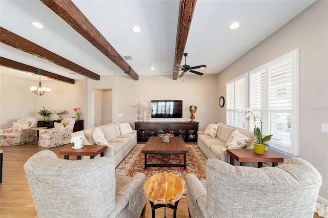 living area featuring ceiling fan with notable chandelier, wood finished floors, beam ceiling, and recessed lighting