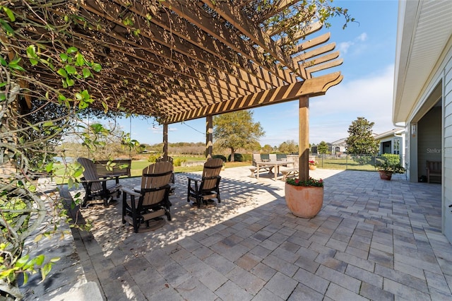 view of patio with fence, a pergola, and outdoor dining space