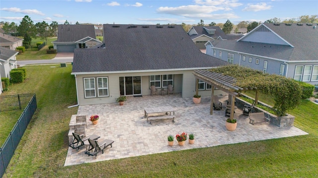 rear view of property featuring a patio, fence, and a residential view