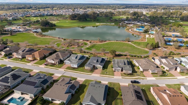 birds eye view of property featuring a water view and a residential view