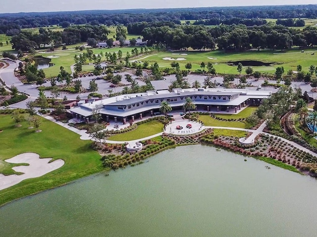 bird's eye view with view of golf course and a water view