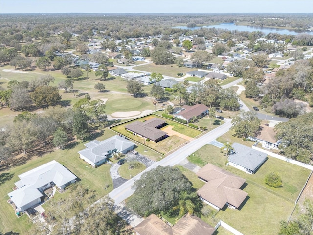 birds eye view of property with a water view and a residential view