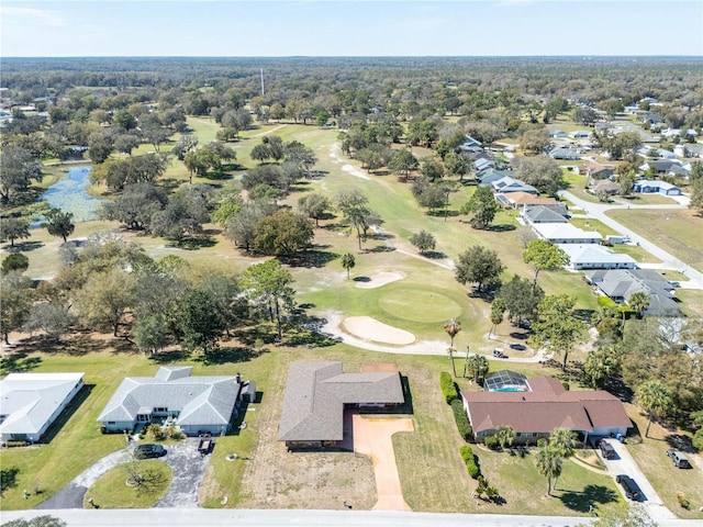 birds eye view of property with view of golf course