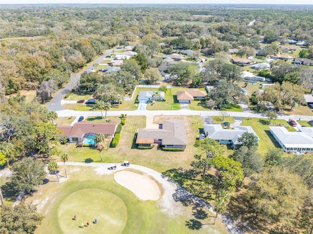 drone / aerial view featuring a forest view and a residential view