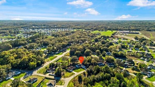 drone / aerial view with a view of trees