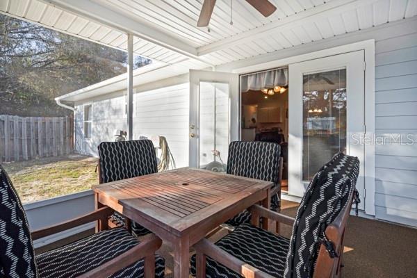 sunroom / solarium with ceiling fan and a wealth of natural light