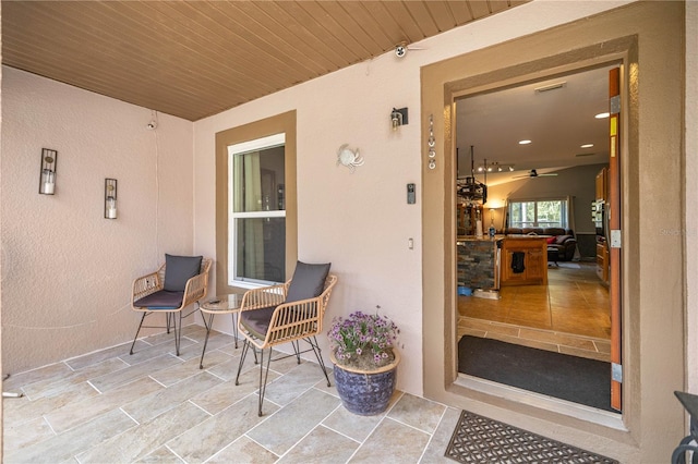 view of exterior entry with stucco siding