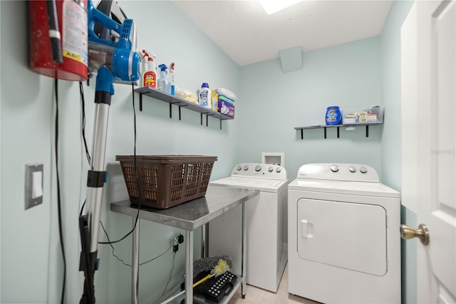 laundry area with laundry area and washing machine and clothes dryer