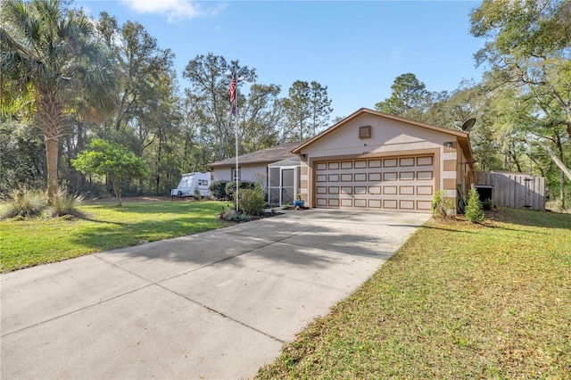 ranch-style home with an attached garage, a front lawn, concrete driveway, and stucco siding