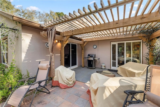 view of patio featuring area for grilling and a pergola