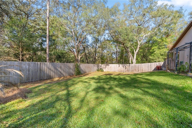 view of yard featuring a fenced backyard