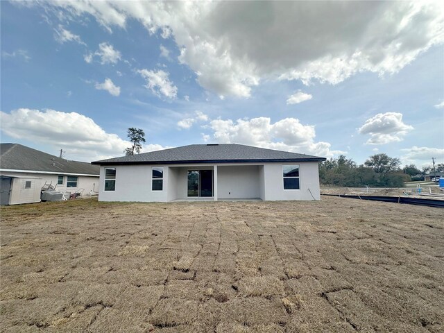 back of property with stucco siding