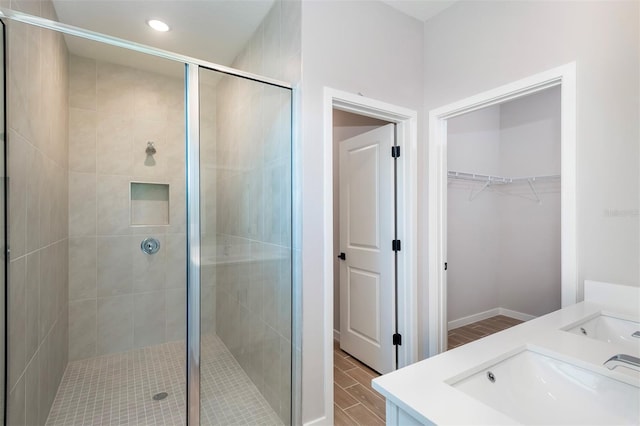3085 SW 131st Place Rd, Ocala, FL 34473 - bathroom with a stall shower, vanity, a spacious closet, recessed lighting, and baseboards