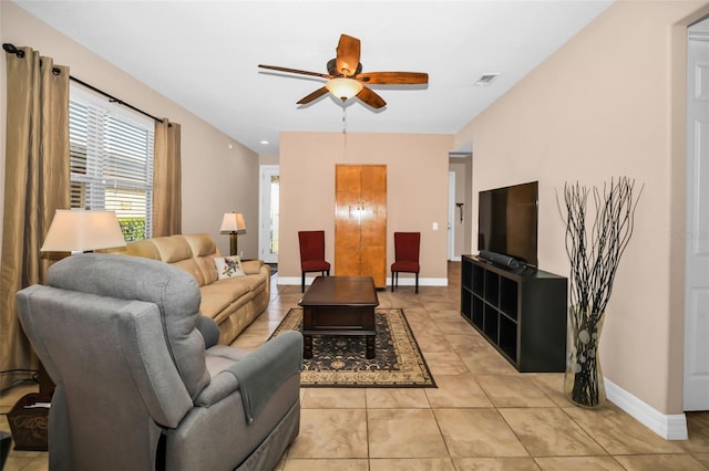 7234 SW 91st Ct, Ocala, FL 34481 - living area featuring a ceiling fan, baseboards, and light tile patterned floors