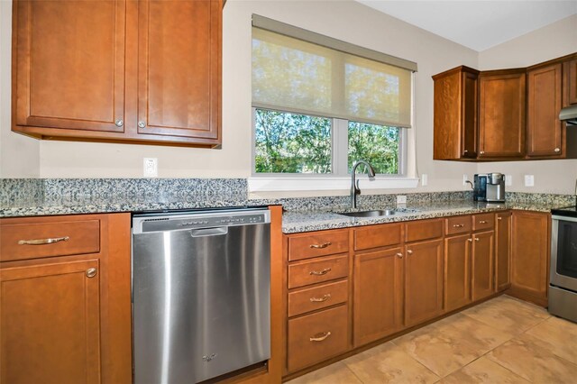 7234 SW 91st Ct, Ocala, FL 34481 - kitchen with stainless steel appliances, a sink, light stone countertops, light tile patterned flooring, and brown cabinetry