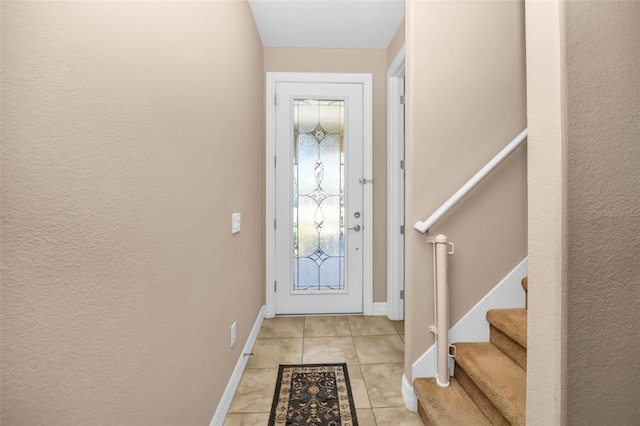 7234 SW 91st Ct, Ocala, FL 34481 - doorway to outside featuring baseboards, stairs, and light tile patterned flooring