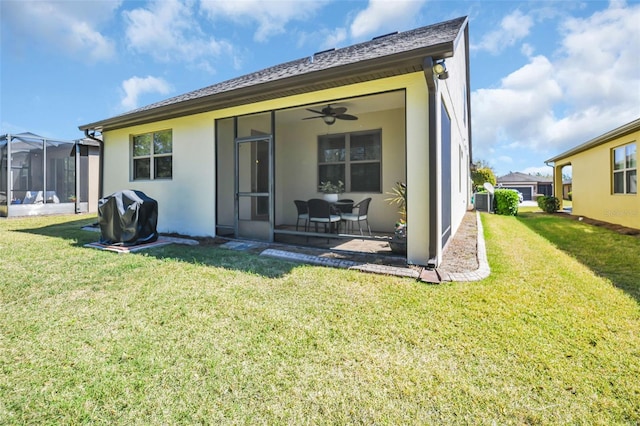 7234 SW 91st Ct, Ocala, FL 34481 - rear view of house with a yard, ceiling fan, stucco siding, and a sunroom
