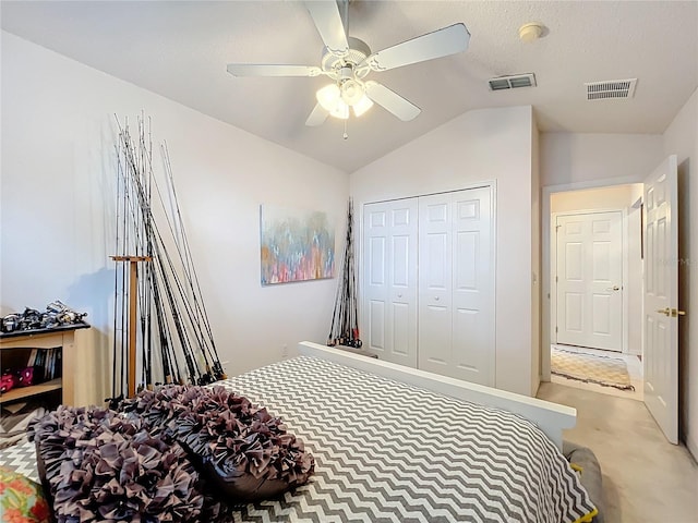 bedroom with lofted ceiling, visible vents, a closet, and light colored carpet