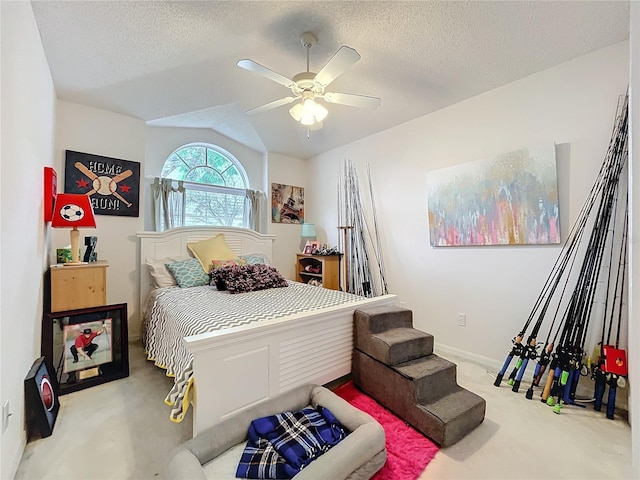 bedroom with light carpet, baseboards, a ceiling fan, vaulted ceiling, and a textured ceiling