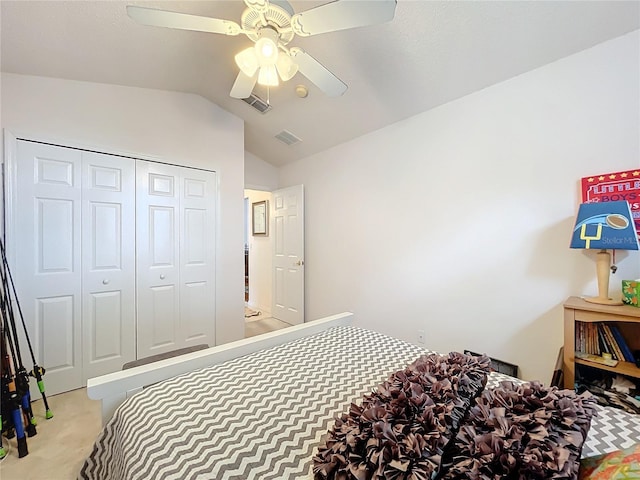 bedroom with lofted ceiling, a closet, visible vents, a ceiling fan, and light carpet