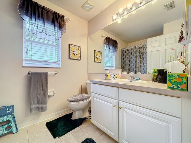 full bathroom featuring toilet, vanity, visible vents, and tile patterned floors