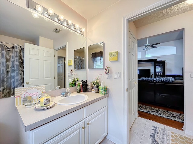 bathroom featuring visible vents, a ceiling fan, connected bathroom, vanity, and tile patterned flooring