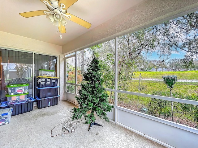 sunroom with a ceiling fan