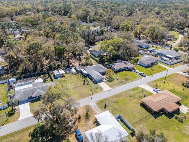 aerial view featuring a view of trees and a residential view