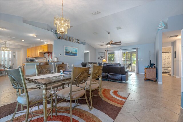 dining space featuring light tile patterned floors, baseboards, visible vents, vaulted ceiling, and ceiling fan with notable chandelier