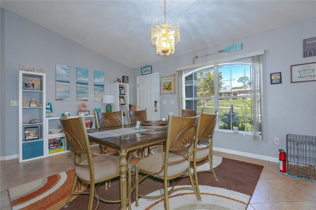 dining area featuring tile patterned floors, baseboards, lofted ceiling, and a notable chandelier