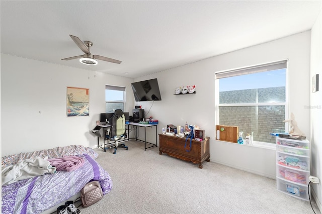 bedroom featuring carpet floors, multiple windows, and ceiling fan