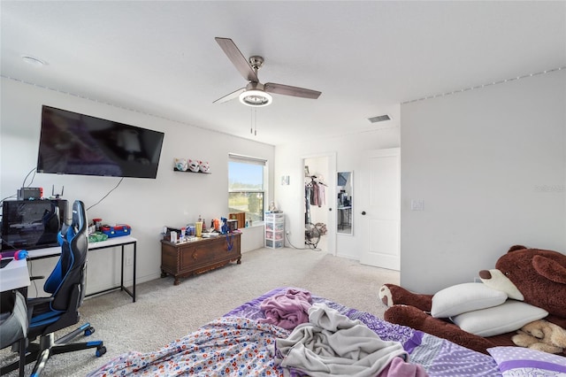 bedroom with a ceiling fan, light colored carpet, and visible vents