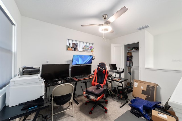 home office featuring visible vents and a ceiling fan