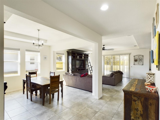 dining space with ceiling fan with notable chandelier, recessed lighting, baseboards, and light tile patterned floors