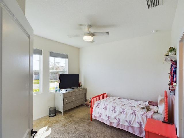 bedroom featuring a ceiling fan, carpet, visible vents, and baseboards