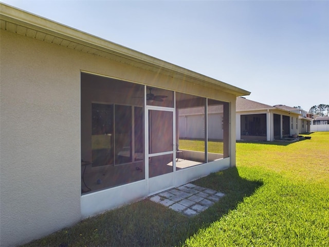 view of yard featuring a sunroom