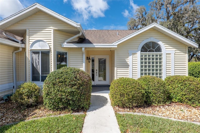 view of front of property featuring roof with shingles