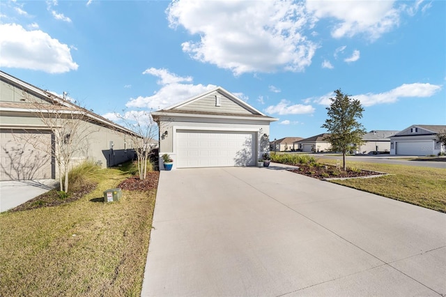 ranch-style house featuring a garage, stucco siding, driveway, and a front yard