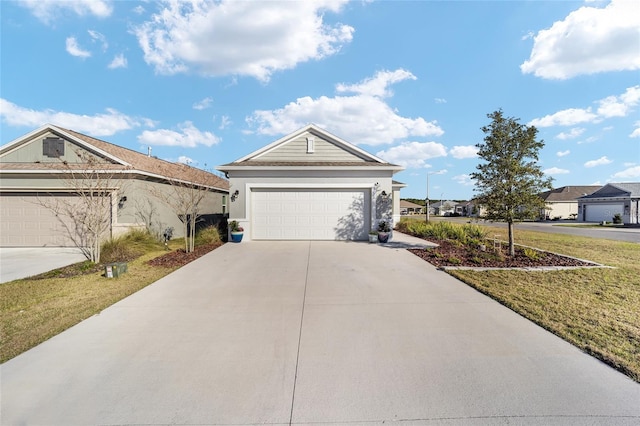 ranch-style house featuring a garage and stucco siding