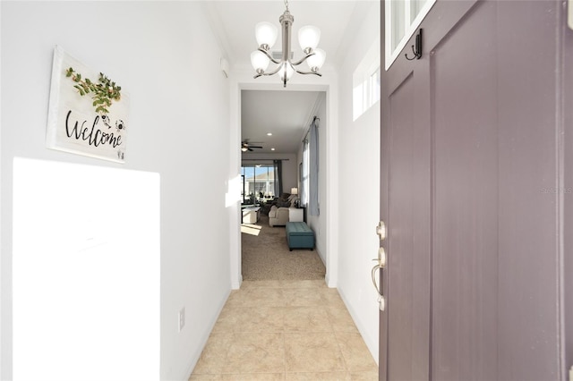 hallway with a notable chandelier