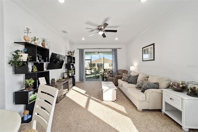 carpeted living room featuring ceiling fan, ornamental molding, visible vents, and recessed lighting