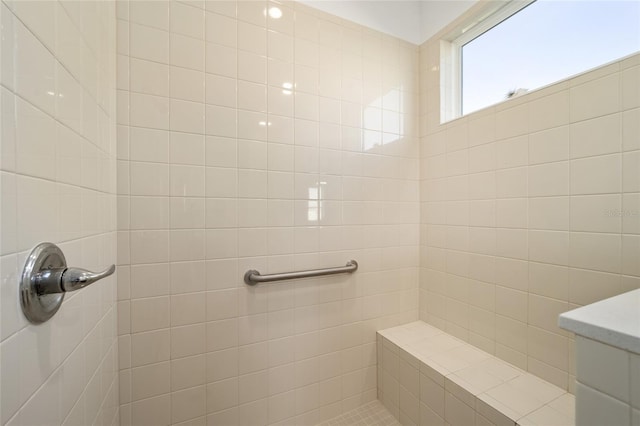 full bathroom with a tile shower