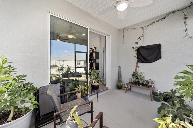 exterior space featuring a ceiling fan