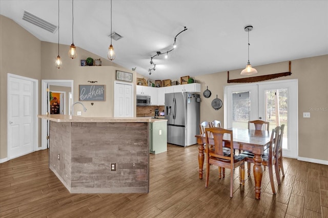 kitchen with visible vents, appliances with stainless steel finishes, light countertops, and wood finished floors